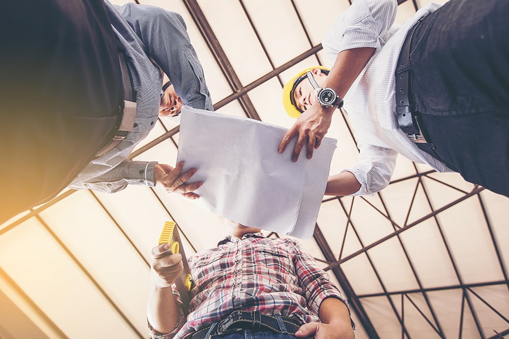 Builders consulting each other