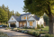 front - BASE MODEL - Modern farmhouse plan, 4 bedrooms, master suite, 3-car garage, fireplace, large kitchen, pantry, laundry room - Greenhills 2