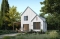 Rear view - BASE MODEL - Scandinavian-style home design featuring Maibec red cedar siding. - Portland