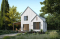 Rear view - BASE MODEL - Scandinavian-style home design featuring Maibec red cedar siding. - Portland