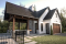 front - BASE MODEL - Plan for garage, boat, small motorhome or car offering a sheltered terrace w/fireplace, a half bath & storage - Portside