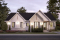 front - BASE MODEL - Spacious one-storey multi-generational home plan with 1 + 3 bedrooms, fireplace and laundry on main unit - Angeline