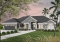 front - BASE MODEL - Large 4 bedroom Mediterranean style house plan with 3.5 baths, 2-car garage, home office - Savoy