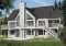 Color version 1 - Rear - Lake chalet house plan with walkout, 5 bedrooms, 9-ft ceilings, cathedral living room and covered terrace - The Lakeshore