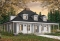front - BASE MODEL - 3 bedroom farmhouse with master on main, huge wraparound covered porch, open area and fireplace - Toulon