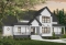 Color version 1 - Front - 2 master suites house plan, 4 bedrooms. 4 bathrooms, 2-car garage, large family room, formal dining room - New Cotton Country
