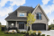 front - BASE MODEL - 4-beds, 3.5 baths, 2-car garage, kitchen with breakfast nook & planning desk, central fireplace, master suite - St. Arnaud