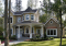 front - BASE MODEL - Farmhouse style house plan, 9' ceiling, home office, large kitchen, double sided fireplace, large bonus room - The Collector