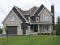 Color version 3 - Front - Luxury Traditional house plan, 4 bedrooms + bonus space, home office, corner fireplace, pantry, 2-car garage - Farrington