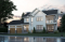 front - BASE MODEL - Modern farmhouse with garage, 4 bedrooms, home theater, office and 3 front balconies - Liana 2