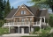 Color version 1 - Front - 4 bedroom Lakefront Cottage-Style house plan with solarium, 2-car garage, double sided fireplace - The Pocono 4
