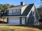 front - BASE MODEL - Two-bedrooms garage apartment, 2 shower rooms, open concept with cathedral ceiling & fireplace - The Saddlery