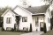 front - BASE MODEL - Split-level home plan with 4 bedrooms, 2 bathrooms, master on main level, covered rear terrace - Sunny Hill